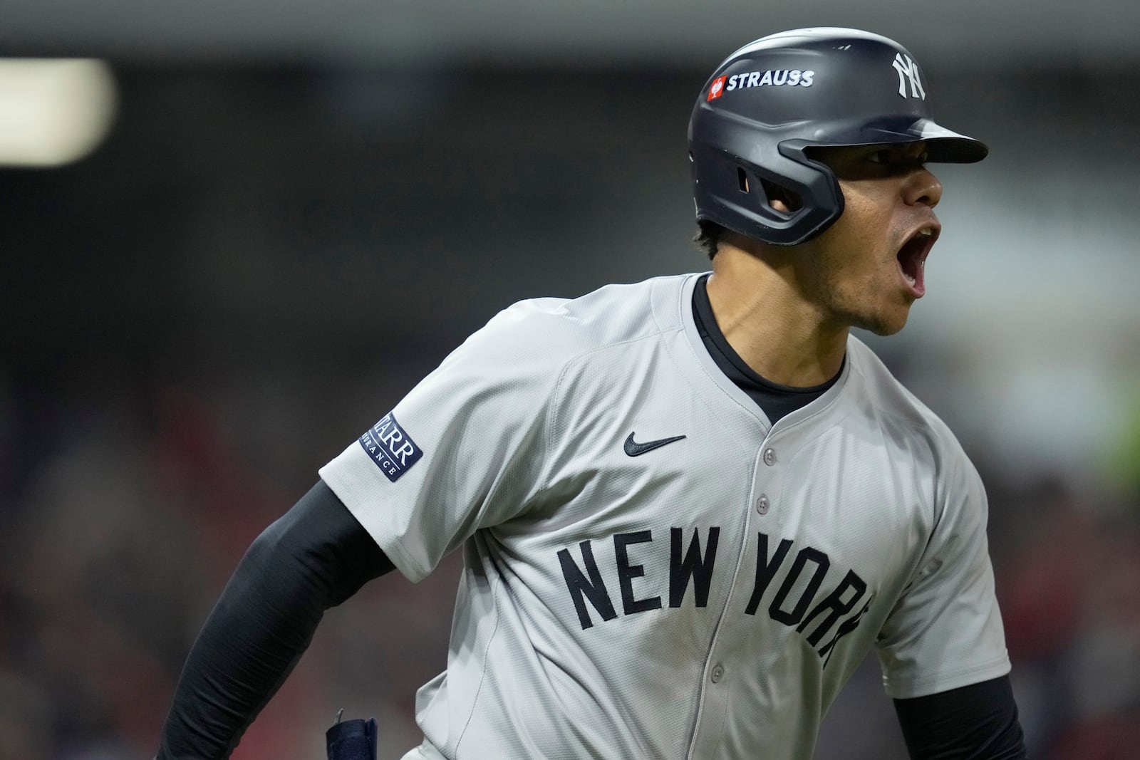 New York Yankees' Juan Soto celebrates after hitting a three-run home run against the Cleveland Guardians during the 10th inning in Game 5 of the baseball AL Championship Series Saturday, Oct. 19, 2024, in Cleveland. (AP Photo/Godofredo A. Vásquez)