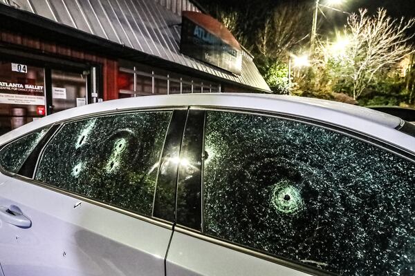 A car with multiple bullet holes could be seen Monday morning parked outside an Atlanta Ballet studio on Amsterdam Avenue, located across the street from Loca Luna.