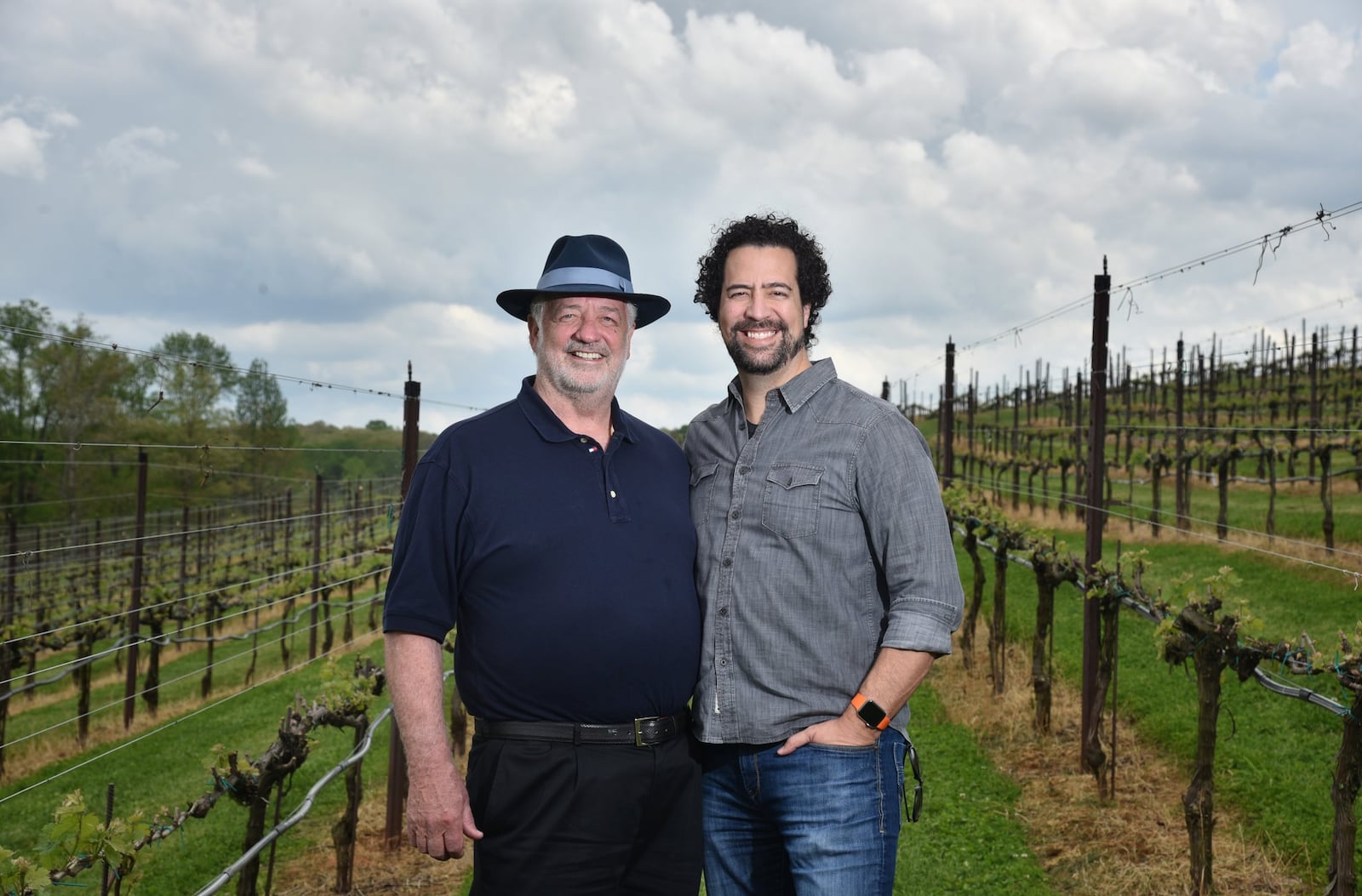 Bob Miller (left), who owns Yonah Mountain Vineyards in Cleveland, Ga., with his wife, moved toward solar energy for the winery and the Millers’ farmhouse thanks to the prompting of his son Eric Miller (right), general manager at Yonah. HYOSUB SHIN / HSHIN@AJC.COM