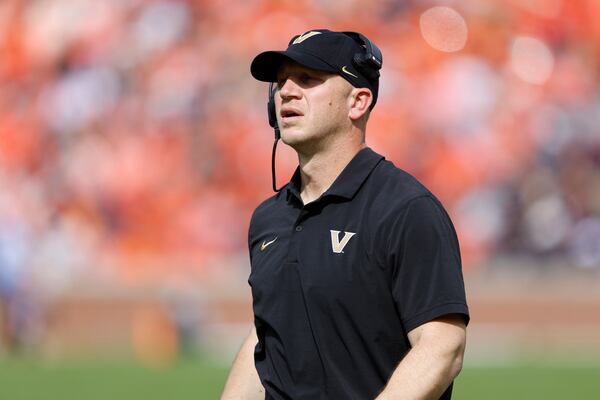 Vanderbilt head coach Clark Lea watches a replay during the first half of an NCAA college football game against Auburn, Saturday, Nov. 2, 2024, in Auburn, Ala. (AP Photo/ Butch Dill)