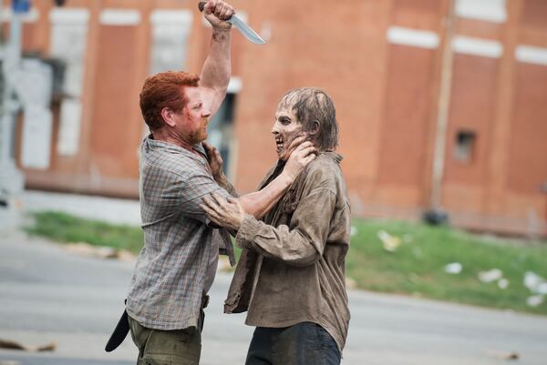  Abraham goes after a zombie as he and his group try to get their way to D.C. CREDIT: AMC