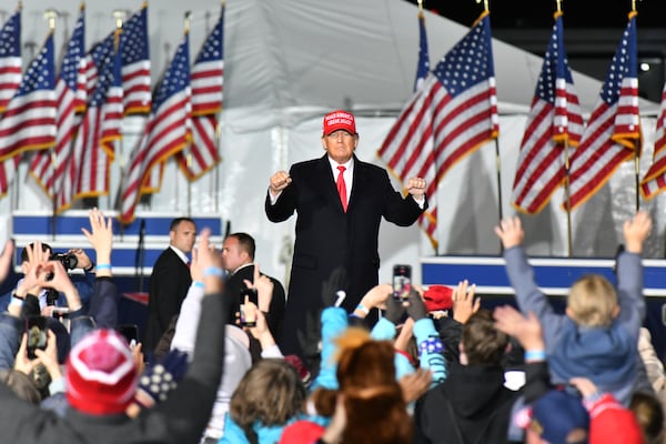 March 26, 2022 Commerce - Former former President Donald Trump dances as he leaves the stage uring a rally for Georgia GOP candidates at Banks County Dragway in Commerce on Saturday, March 26, 2022. (Hyosub Shin / Hyosub.Shin@ajc.com)