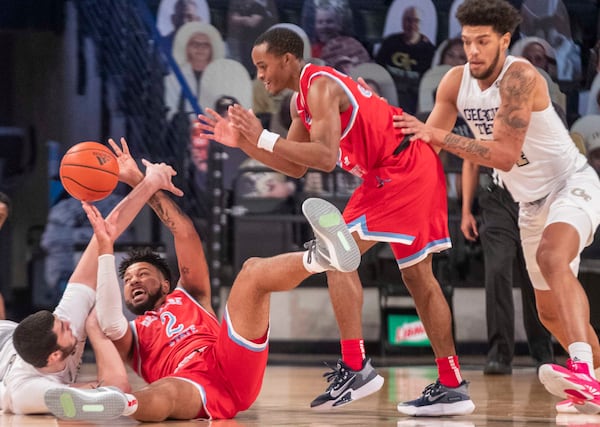 Tech and Delaware State players battle for the ball during the second half Sunday, Dec. 20, 2020, at McCamish Pavilion in Atlanta. The Tech Yellow Jackets won 97- 69. (Alyssa Pointer / Alyssa.Pointer@ajc.com)