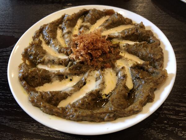 Kashk badenjoon is one of the delicious eggplant dips at Taaj Kabob & Grill. The eggplant is fried, smashed, drizzled with whey and garnished with crispy fried onions and mint. CONTRIBUTED BY WENDELL BROCK