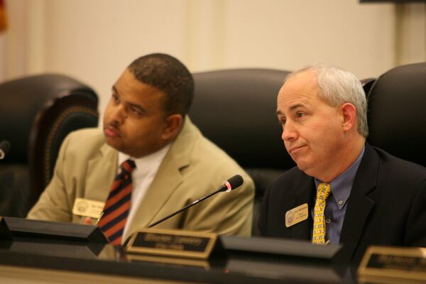 Jerry Oberholtzer (right) in June 2008, when he was mayor of Snellville. On the left is Mike Williams, city attorney at the time. (Jessica McGowan / AJC file photo)