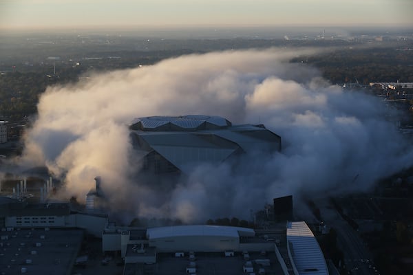 A ball of dust enveloped Mercedes-Benz Stadium as the Georgia Dome was imploded on Nov. 20, 2017. 