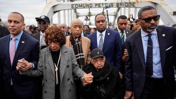 U.S. Rep. Hakeem Jeffries, D-N.Y., (left), U.S. Rep. Maxine Waters, D-Calif., the Rev. Al Sharpton, the Rev. Jesse Jackson and NAACP President Derick Johnson, march across the Edmund Pettus bridge Sunday. 