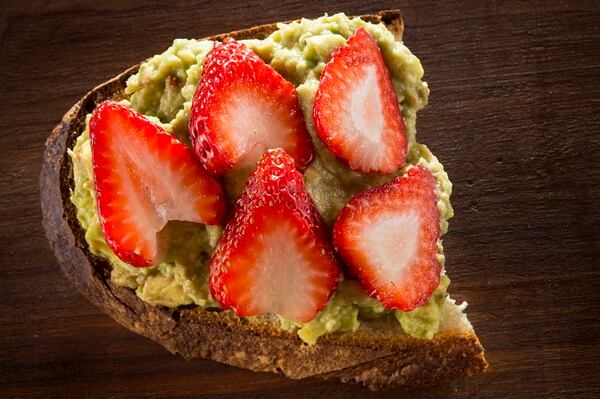 Avocado Toast with fresh strawberries. (Tammy Ljungblad/Kansas City Star/TNS)