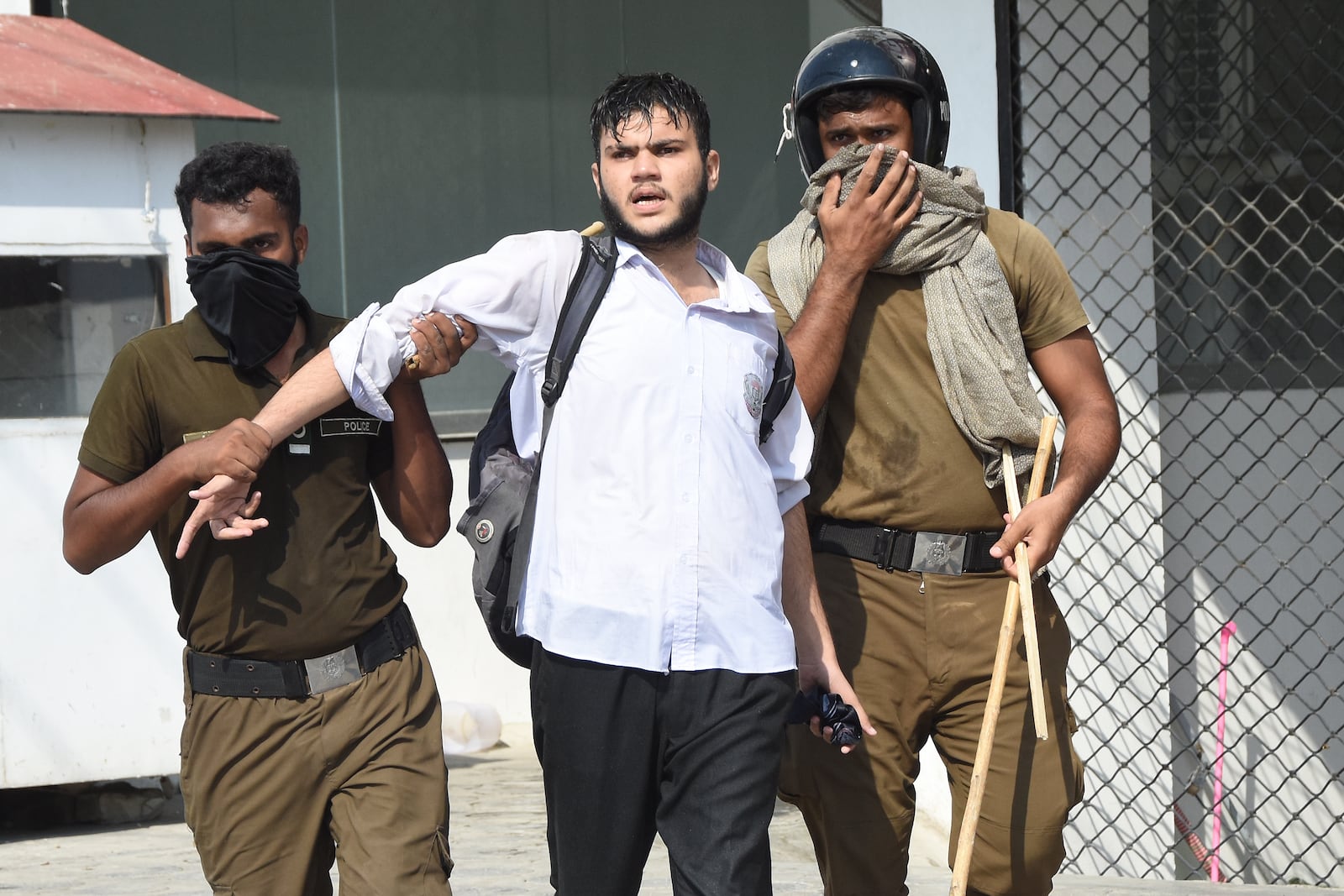 Police officers detain a demonstrator during a students' protest over an alleged on-campus rape in Punjab, in Rawalpindi, Pakistan, Thursday, Oct. 17, 2024. (AP Photo/W.K. Yousafzai)