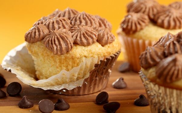 Avani Shah's chocolate ganache frosting, based on whipped cream, pipes up beautifully to decorate cupcakes or other treats. (Michael Tercha/Chicago Tribune/TNS)