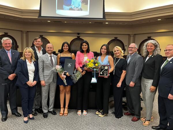 Marcelo Zapata's wife, Selina, and daughter, Isabella, are pictured with family members, Roswell Mayor Kurt Wilson and City Council. Courtesy Facebook