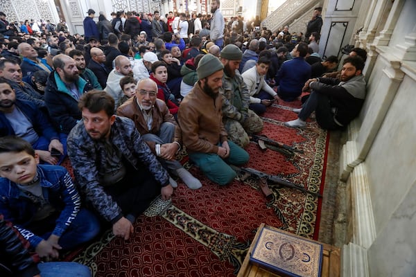 Syrians attend Friday prayers inside the 7th century Umayyad Mosque in Damascus, Syria, Friday, Dec. 13, 2024. (AP Photo/Omar Sanadiki)