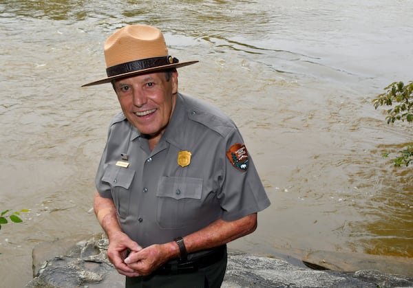 230829 Sandy Springs, Ga: Jerry Hightower stands on Ôproposal rockÕ where many a couple have done just that. Photo for Aging in Atlanta, Community Profile on Ranger Jerry Hightower, Environmental Education Coordinator for the National Park Service, Chattahoochee River National Recreation Area. Photo taken August 29, 2023 at the Island Ford Unit of the Chattahoochee River National Forest Area in Sandy Springs. (CHRIS HUNT FOR THE ATLANTA JOURNAL-CONSTITUTION)