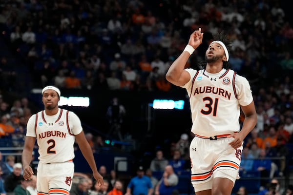 Auburn forward Chaney Johnson (31) celebrates scoring Creighton during the first half in the second round of the NCAA college basketball tournament, Saturday, March 22, 2025, in Lexington, Ky. (AP Photo/Brynn Anderson)