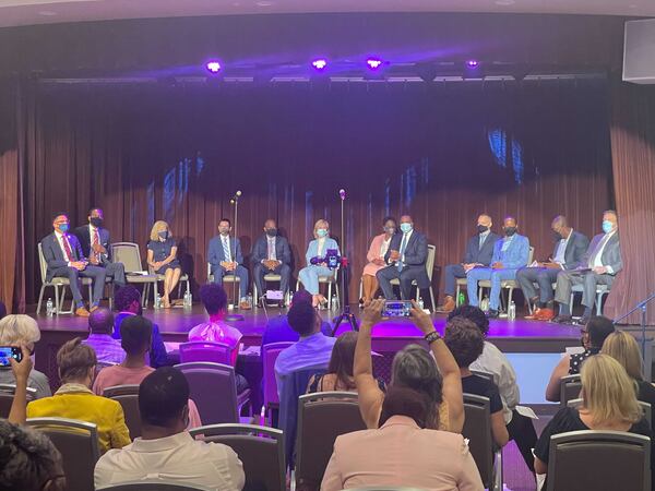 The stage was crowded at the latest mayoral forum. (Wilborn Nobles / Wilborn.Nobles@ajc.com)