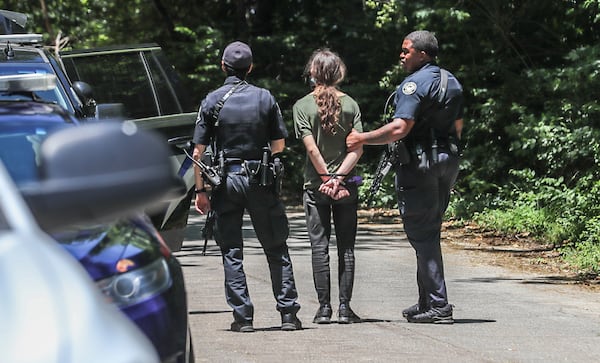 Police make arrests Tuesday, May 17, 2022, at encampment of opposition to the massive training center planned for Atlanta’s police officers and firefighters. (John Spink/ John.Spink@ajc.com)