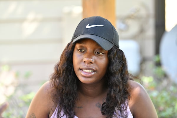 July 22, 2021 Austell - Breanna Brimmage, a resident at Azure at Riverside in Austell, speaks with other residents and community stakeholders outside The Thrive Resource Center at the Kingsley Village Apartments in Austell on Thursday, July 22, 2021. For the past few months, a group of single mothers in Cobb County has been advocating that the county give families more rental assistance or implement a countywide moratorium on evictions to ensure no families are displaced if they canÕt pay rent. (Hyosub Shin / Hyosub.Shin@ajc.com)