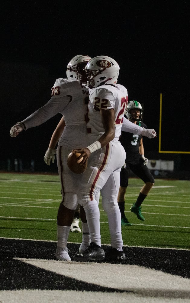 Donovan Journey (right), junior running back for Mill Creek, and Christian Mcintyre (left), senior full back for Mill Creek, chest bump after scoring a touchdown during the Mill Creek vs. Roswell high school football game on Friday, November 27, 2020, at Roswell High School in Roswell, Georgia. Mill Creek led Roswell 27-21 at the end of the third quarter. CHRISTINA MATACOTTA FOR THE ATLANTA JOURNAL-CONSTITUTION