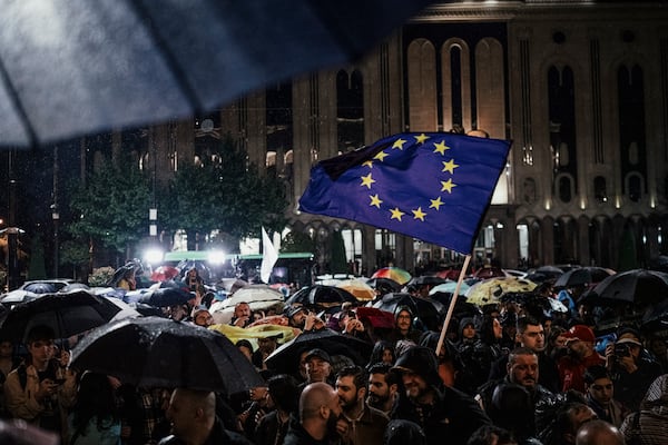 Protesters outside the Parliament of Georgia in Tbilisi wave a European Union flag as they demonstrate in May against the resumption of direct flights from Russia to the former Soviet republic. Russia invaded its neighbor in 2008, and the two countries remain in perennial struggle. (Tako Robakidze/The New York Times)
                      