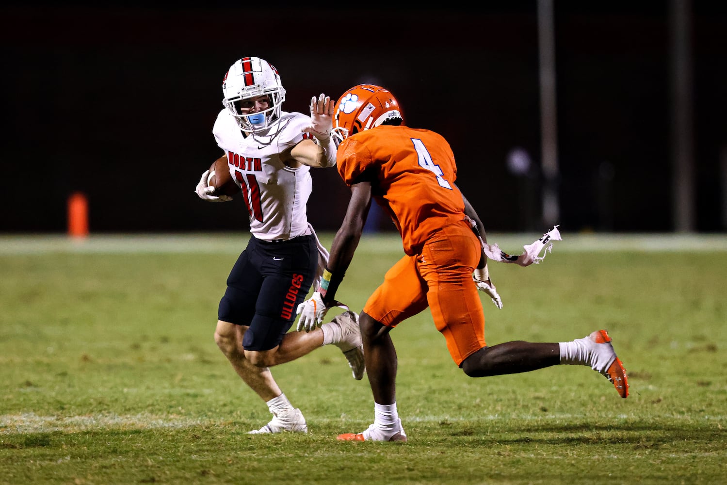 North Gwinnett wide receiver Cade Funderburk (11) runs the ball and attempts to stiff arm Parkview defensive back Mike Matthews (4) during a GHSA 7A high school football game between the North Gwinnett Bulldogs and the Parkview Panthers at Parkview High School in Lilburn, Ga., on Friday, Sept. 3, 2021. (Casey Sykes for The Atlanta Journal-Constitution)