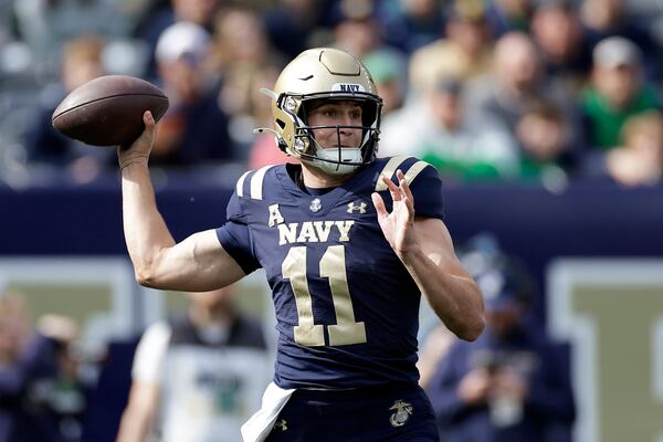 Navy quarterback Blake Horvath (11) throws a pass during the first half of an NCAA college football game against Notre Dame, Saturday, Oct. 26, 2024, in East Rutherford, N.J. (AP Photo/Adam Hunger)