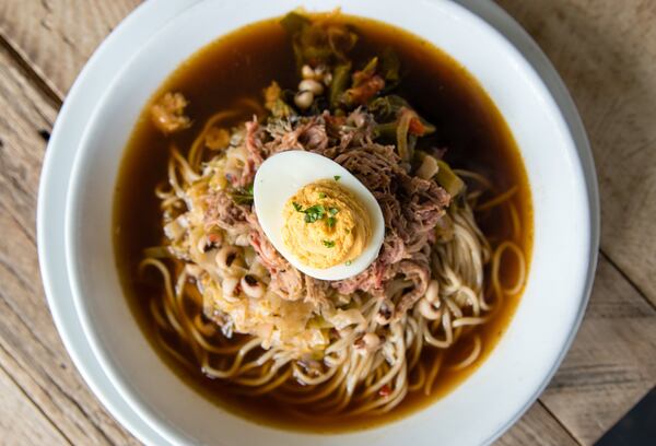 In the Southern Bowl at Southbound, a huge portion of noodles swim in pot liquor-style broth, and the dish is topped with a deviled egg. CONTRIBUTED BY HENRI HOLLIS