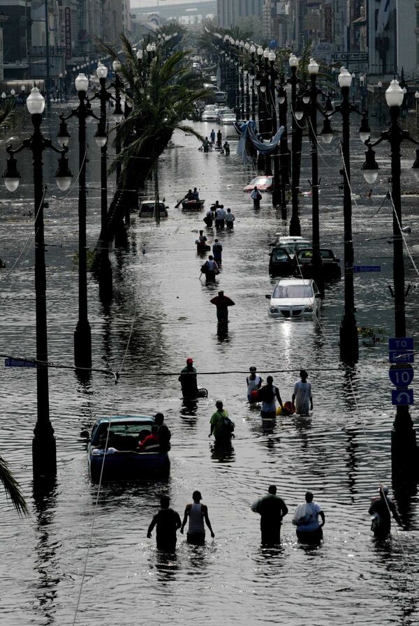 083005 hurkat gc 20--New Orleans, LA--Stranded people make their way along Canal Street looking south as flooding keeps on invading the city Tuesday, August 30, 2005, New Orleans, LA. Hurricane Katrina pounded the New Orleans Monday causing widespread damage and flooding. Staff Photo by Gary Coronado/The Palm Beach Post NOT FOR DISTRIBUTION OUTSIDE COX PAPERS. OUT PALM BEACH, BROWARD, MARTIN, ST.LUCIE, INDIAN RIVER AND OKEECHOBEE COUNTIES IN FLORIDA. OUT ORLANDO. OUT TV, OUT MAGAZINES, OUT TABLOIDS, OUT WIDE WORLD, OUT INTERNET USE. NO SALES. Is the state takeover in New Orleans a workable model for Georgia? (AJC File Photo)