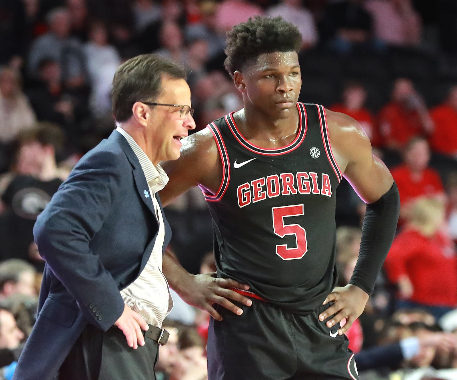 Georgia head coach Tom Crean confers with guard Anthony Edwards.   Curtis Compton ccompton@ajc.com