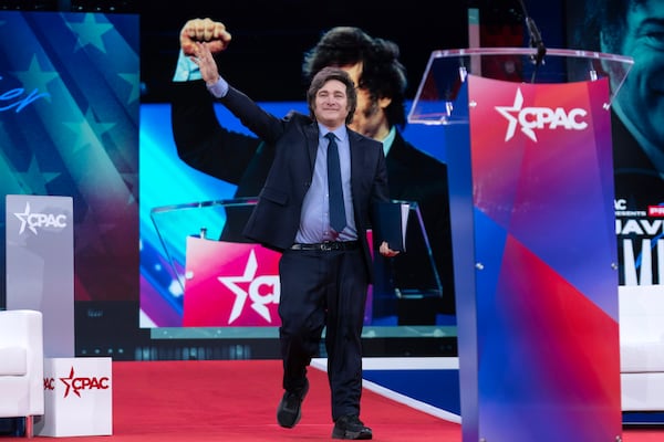 Argentina's President Javier Milei waves to the crowd before speaking at the Conservative Political Action Conference, CPAC, at the Gaylord National Resort & Convention Center, Saturday, Feb. 22, 2025, in Oxon Hill, Md. (AP Photo/Jose Luis Magana)