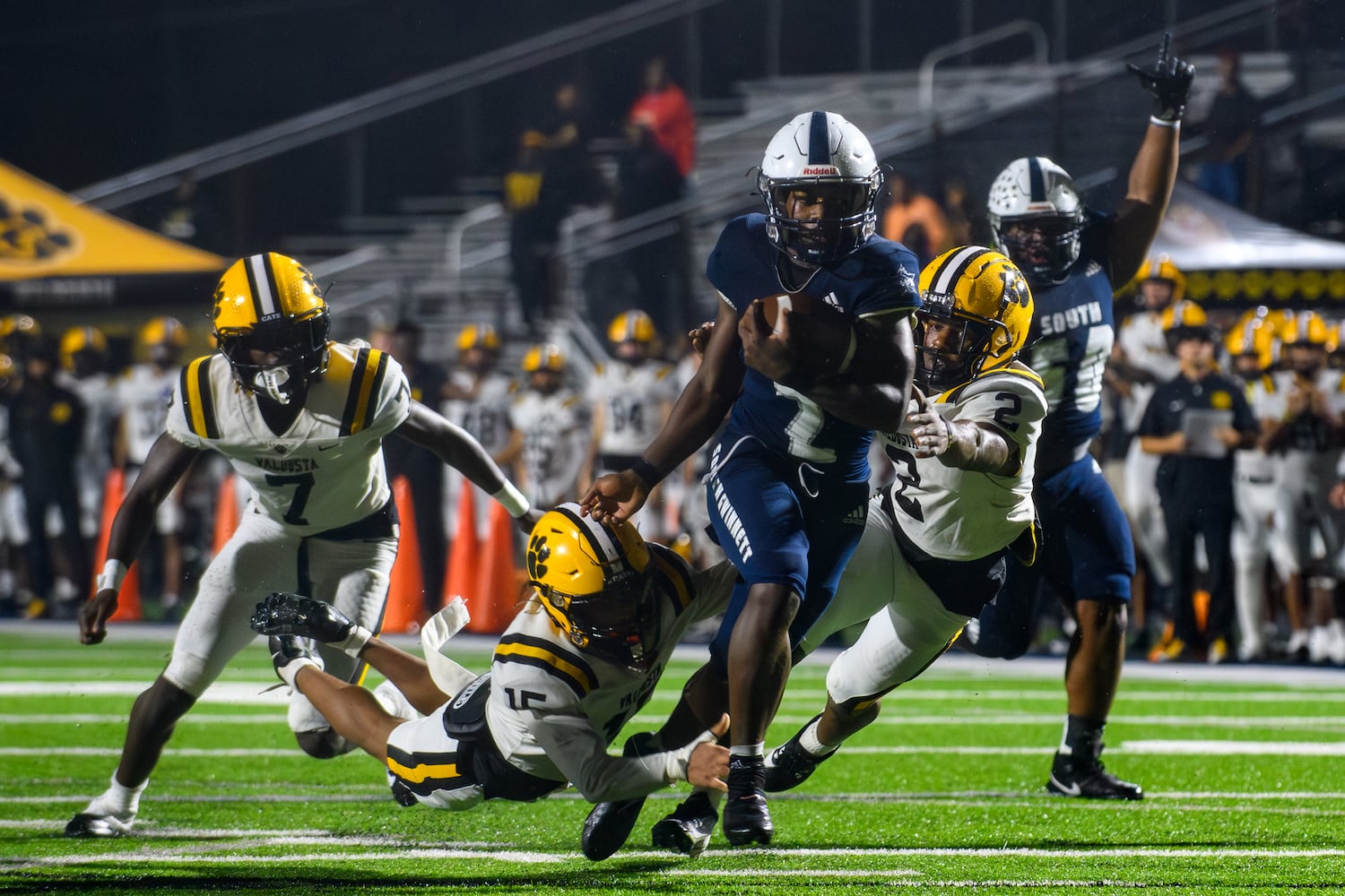 South Gwinnett’s Xavier Butler gets past the defense. (Jamie Spaar for the Atlanta Journal Constitution)