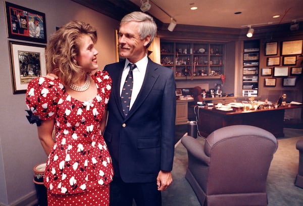 Ted Turner is shown in his office at CNN Center with his daughter Laura on July 7, 1988. (ANDY SHARP/AJC staff)