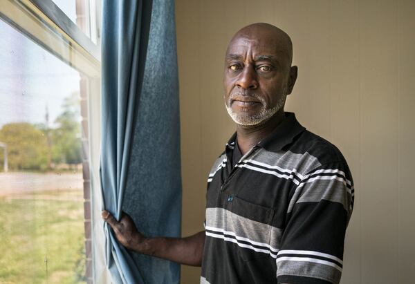 Mike Haynie poses for a portrait in the Kerr Cottage located on the former United Methodist Children's Home in Decatur. This photo and audio clips from Haynie will be on display at the upcoming DeKalb History Center exhibit. Courtesy of Beate Sass