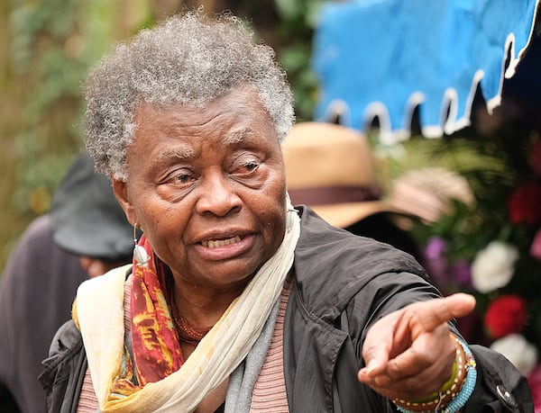 Sandy Benjamin-Hannibal gathered with the quilting community to celebrate the recommittal and dedication of a new headstone for Harriet and Armstead Powers Saturday December 2, 2023 at the Gospel Pilgrim Cemetery in Athens, GA. Powers was an emancipated slave whose quilts can be seen at the Smithsonian Museum and the Museum of Fine Arts in Boston. 

credit: Nell Carroll for the AJC