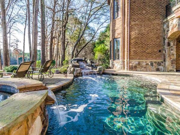 A Suwanee home for sale for $3.95 million overlooks the River Club's Greg Norman golf course.