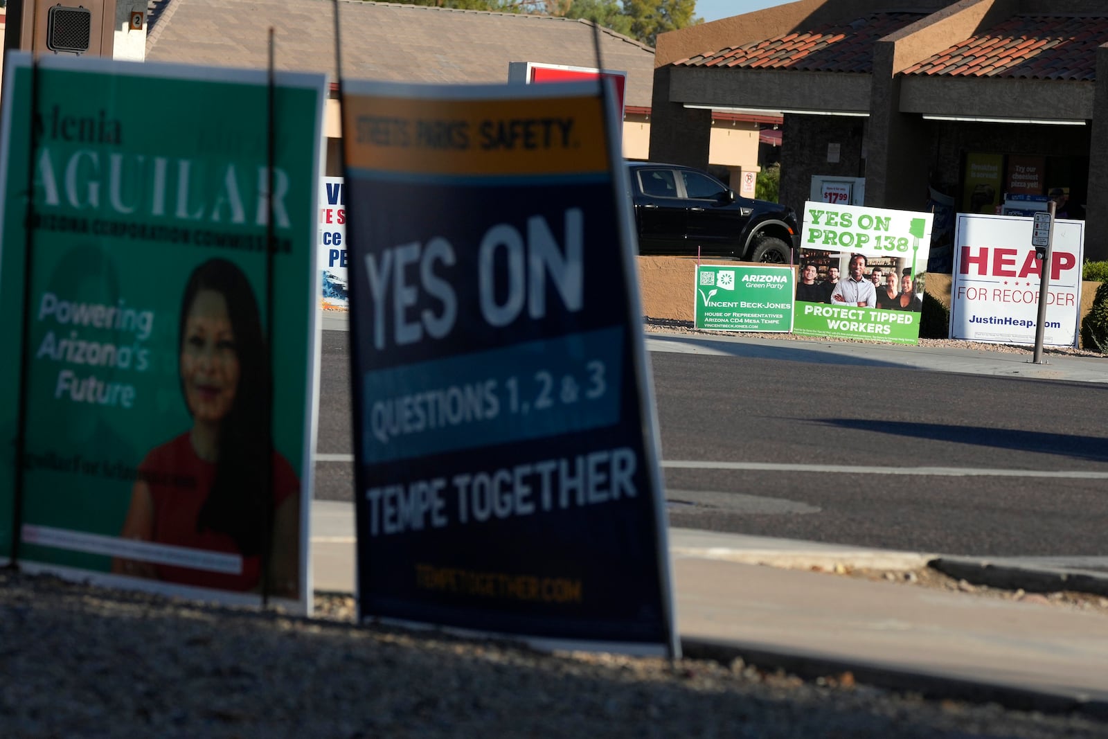 Some of the many political signs on display for the upcoming general election Thursday, Sept. 26, 2024, in Tempe, Ariz. (AP Photo/Ross D. Franklin)