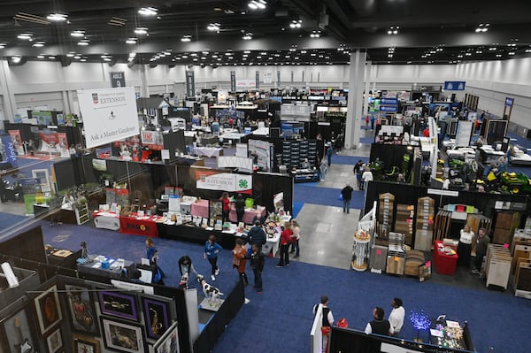 People tour vendors during North Atlanta Home Show at Gas South Convention Center, Friday, Jan. 27, 2023, in Duluth. The older existing convention center space is now being renovated, a full-service hotel is being built on the Gas South district. (Hyosub Shin / Hyosub.Shin@ajc.com)