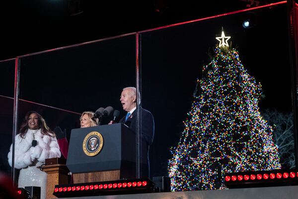 (Left to right) Country music artist Mickey Guyton, first lady Jill Biden and President Joe Biden participated in the 2023 National Christmas Tree lighting festivities at the White House.