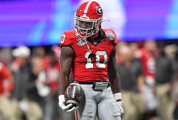 Georgia's wide receiver Kearis Jackson (10) reacts after catching a pass during the fourth quarter of the College Football Playoff Semifinal between the Georgia Bulldogs and the Ohio State Buckeyes at the Chick-fil-A Peach Bowl In Atlanta on Saturday, Dec. 31, 2022. (Hyosub Shin / Hyosub.Shin@ajc.com)