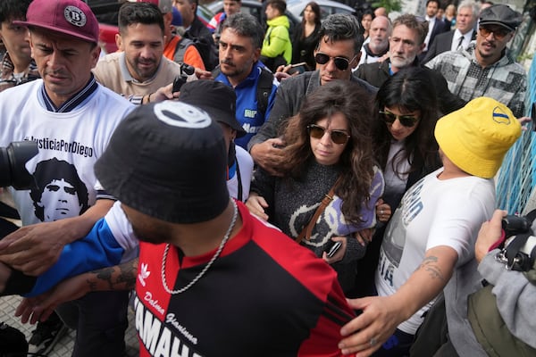 Dalma and Yanina Maradona, daughters of late soccer star Diego Maradona, arrive at court on the first day of a trial for homicide by negligence against the medical team that treated their father, in San Isidro on the outskirts of Buenos Aires, Argentina, Tuesday, March 11, 2025. (AP Photo/Natacha Pisarenko)