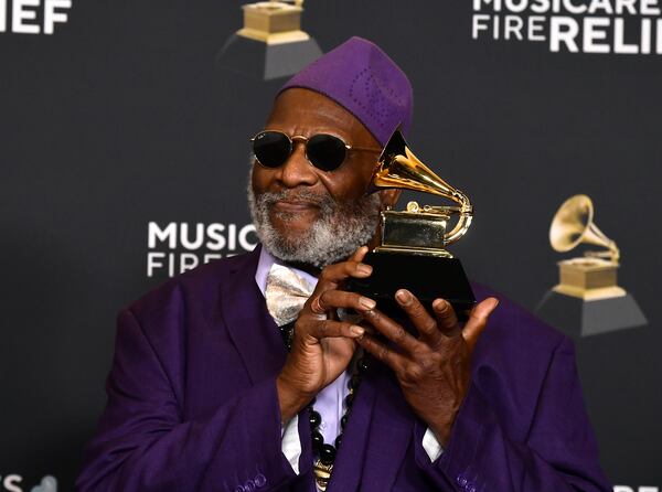 Lifetime Achievement Honoree musician Taj Mahal poses in the press room with the award for traditional blues album for "Swingin' Live at the church in Tulsa" during the 67th annual Grammy Awards on Sunday, Feb. 2, 2025, in Los Angeles. (Photo by Richard Shotwell/Invision/AP)