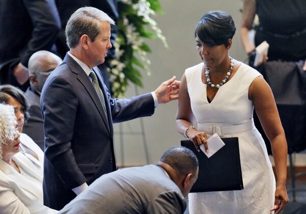 August 28, 2019 - Atlanta - Gov. Brian Kemp stands as Mayor Keisha Lance Bottoms returns to her seat after delivering her reflections.  A "Celebration of Life" was held for Christopher Redding Edwards II, Erin Victoria Edwards, and their mother, Dr. Marsha Edwards at Cascade United Methodist Church in Atlanta. Bob Andres / robert.andres@ajc.com