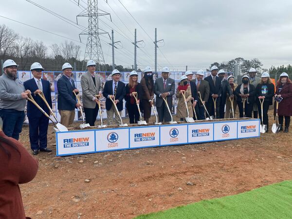 Fulton County Commission and staff ceremonially broke ground Thursday, Dec. 16, 2021 on the spot of a $38 million animal shelter that will provide more humane care. (Ben Brasch/AJC)