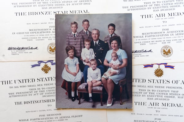 Army Maj. William Callinan with his wife, Marilyn, and children. His daughter, Margo Truett, said of him: “I was his only girl. He loved me so completely.” (Arvin Temkar / arvin.temkar@ajc.com)