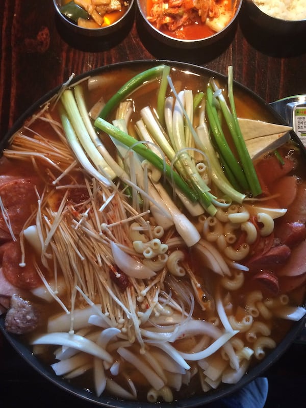 The budae jjigae at Next Door is a spicy kimchi soup with an abundance of sausage and veggies. This is how it is brought out, before being cooked tableside. CONTRIBUTED BY WENDELL BROCK