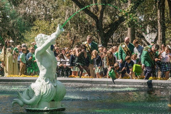 Members of the 2025 St. Patrick’s Day Parade Committee pour green dye into the fountain in Forsyth Park on March 7, 2025 in Savannah, GA. The dying of the fountain marks the beginning of the city’s St. Patrick’s Day festivities. (Justin Taylor/The Atlanta Journal Constitution)