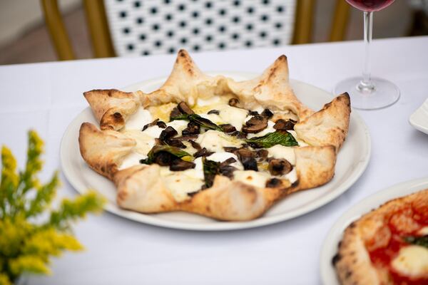 Amalfi Tartufo E Funghi Carnevale Pizza with gourmet mushroom blend, fontina, truffle oil, and ricotta-filled crust. (Mia Yakel for The Atlanta Journal-Constitution)