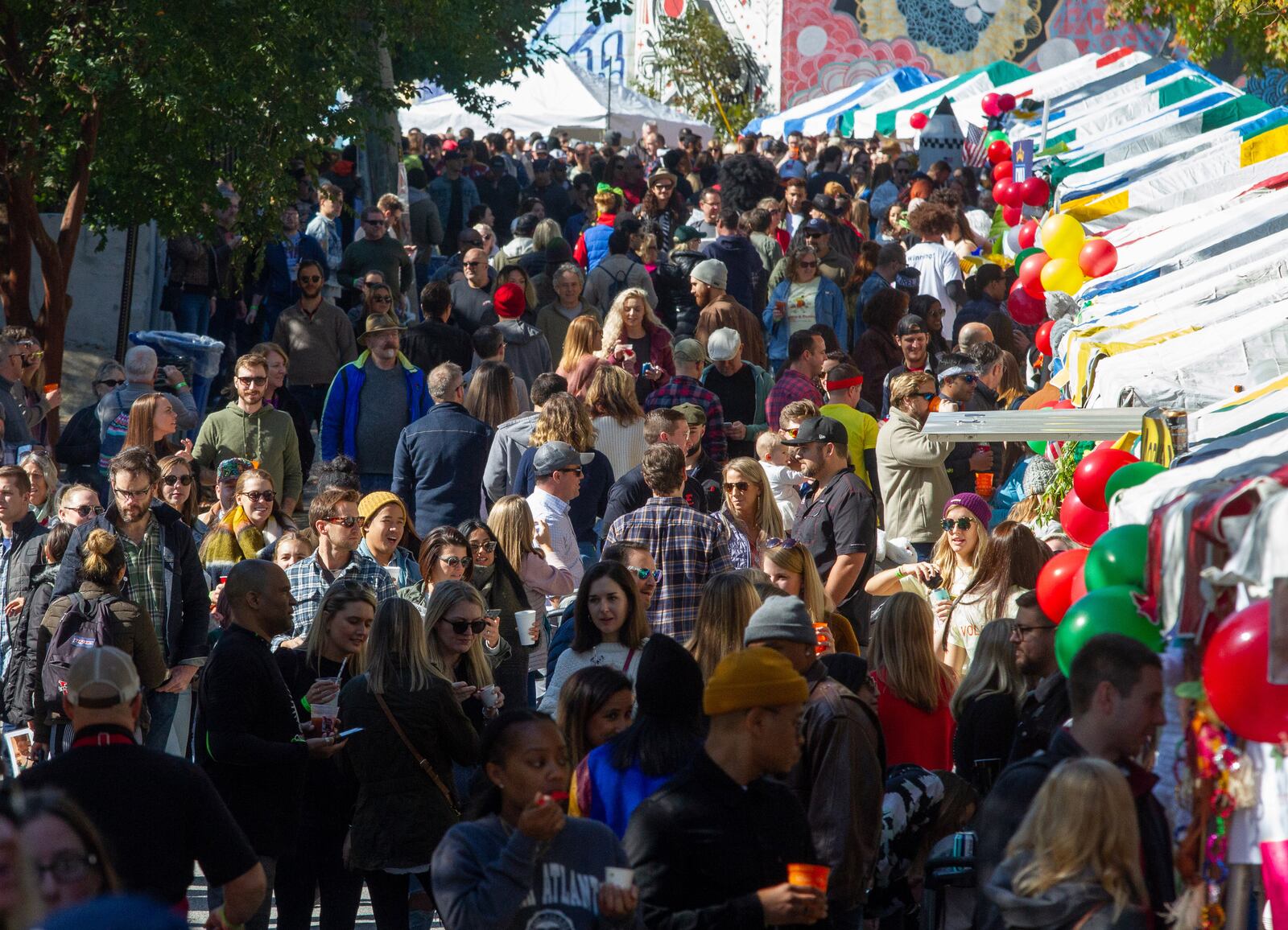 A large crowd packs Wylie Street in front of the chili team booths during the Chomp & Stomp Chili Cookoff and Bluegrass Festival in Cabbagetown in 2019. Steve Shaefer AJC File 2019