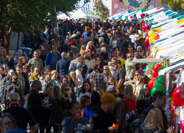 A large crowd packs Wylie Street in front of the chili team booths during the Chomp & Stomp Chili Cookoff and Bluegrass Festival in Cabbagetown in 2019. Steve Shaefer AJC File 2019