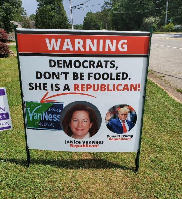 Yard signs like this one have sprouted on lawns in Rockdale County advertising JaNice VanNess' GOP background ahead of the June 18 runoff in the Democratic primary for chair of the County Commission. (AJC file)