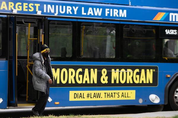 A passenger gets off the bus at the Marta bus stop near Stonecrest Mall on Tuesday in Stonecrest. CHRISTINA MATACOTTA FOR THE ATLANTA JOURNAL-CONSTITUTION